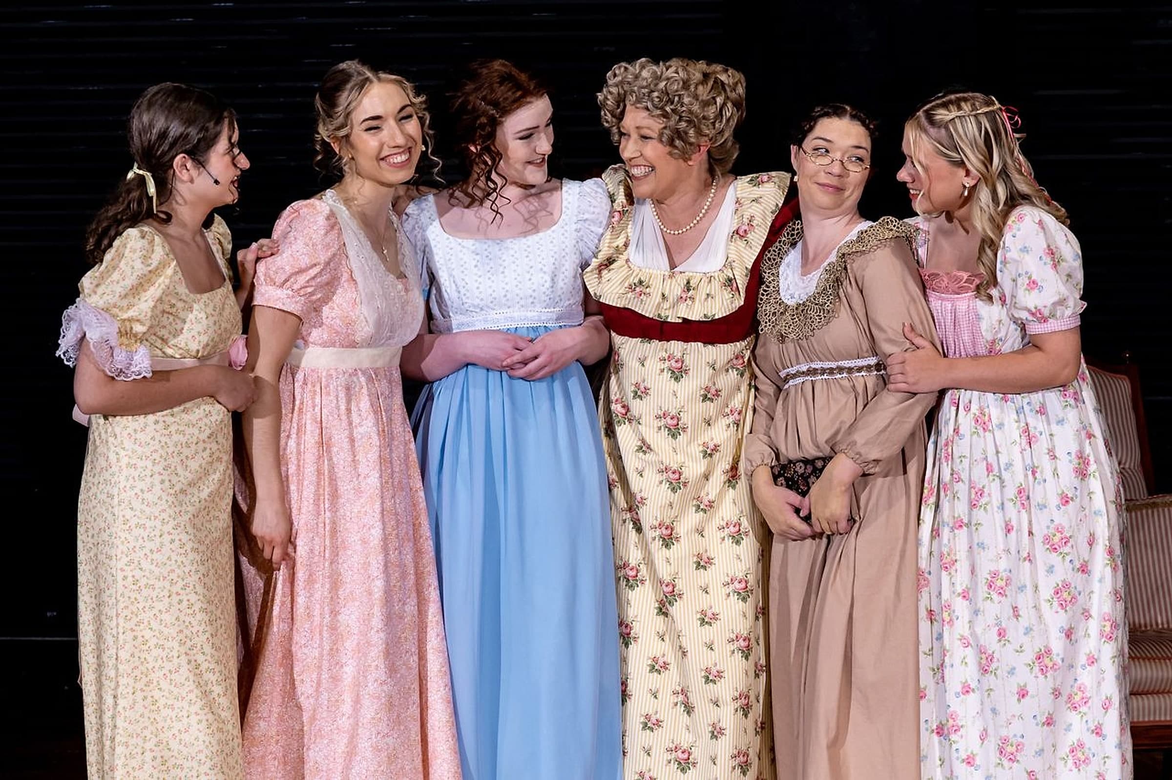 Alive Theatre cast members in costume together on stage